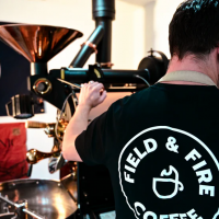 Back of a barista making coffee