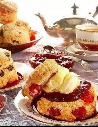 Scones on a table with a teapot