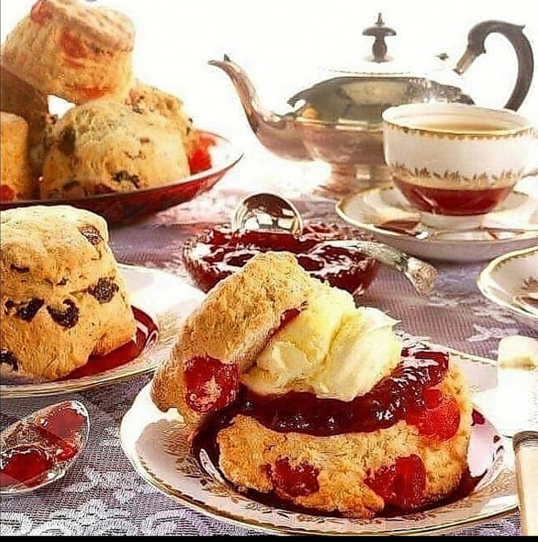 Scones on a table with a teapot