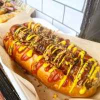 Corn Dog in a bun with sauce on