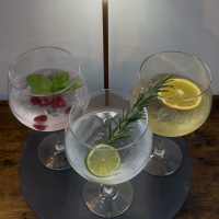 Three glasses of gin with a mixer