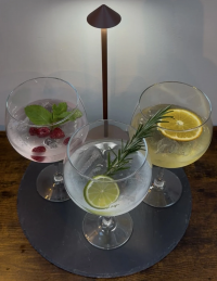 Three glasses of gin with a mixer